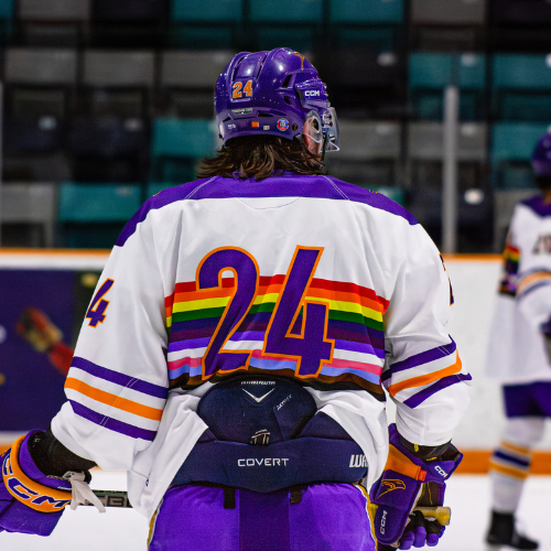 Hockey player wearing the Laurier Pride jersey